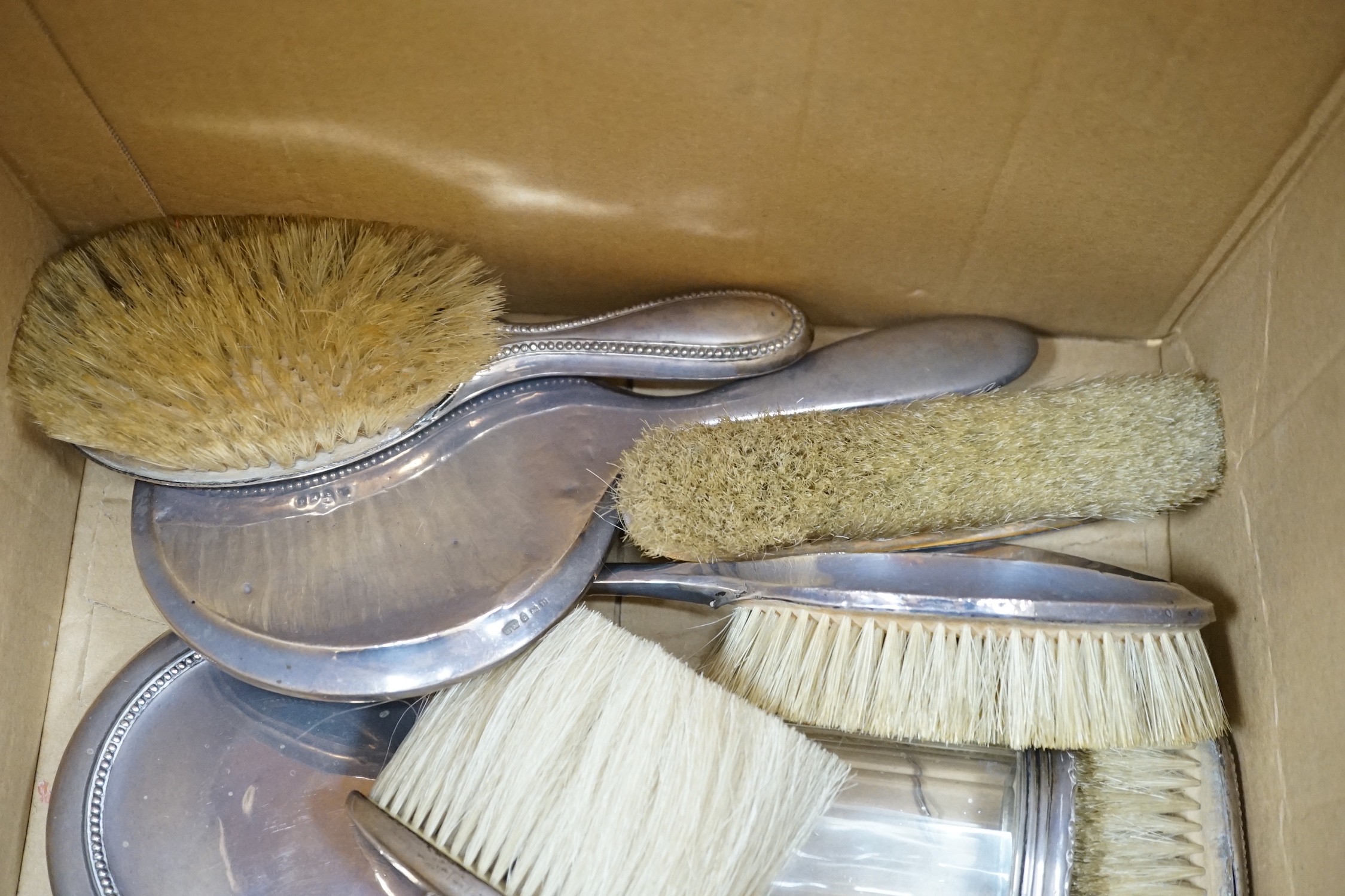 A quantity of assorted silver mounted hand mirrors, brushes and toilet jars, various dates and makers